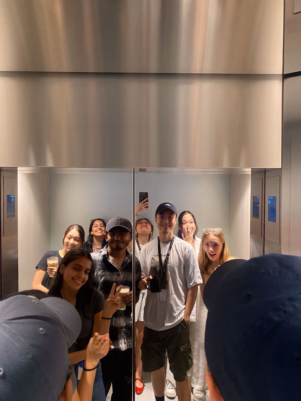 A look at no-longer-desperate interns standing in an elevator